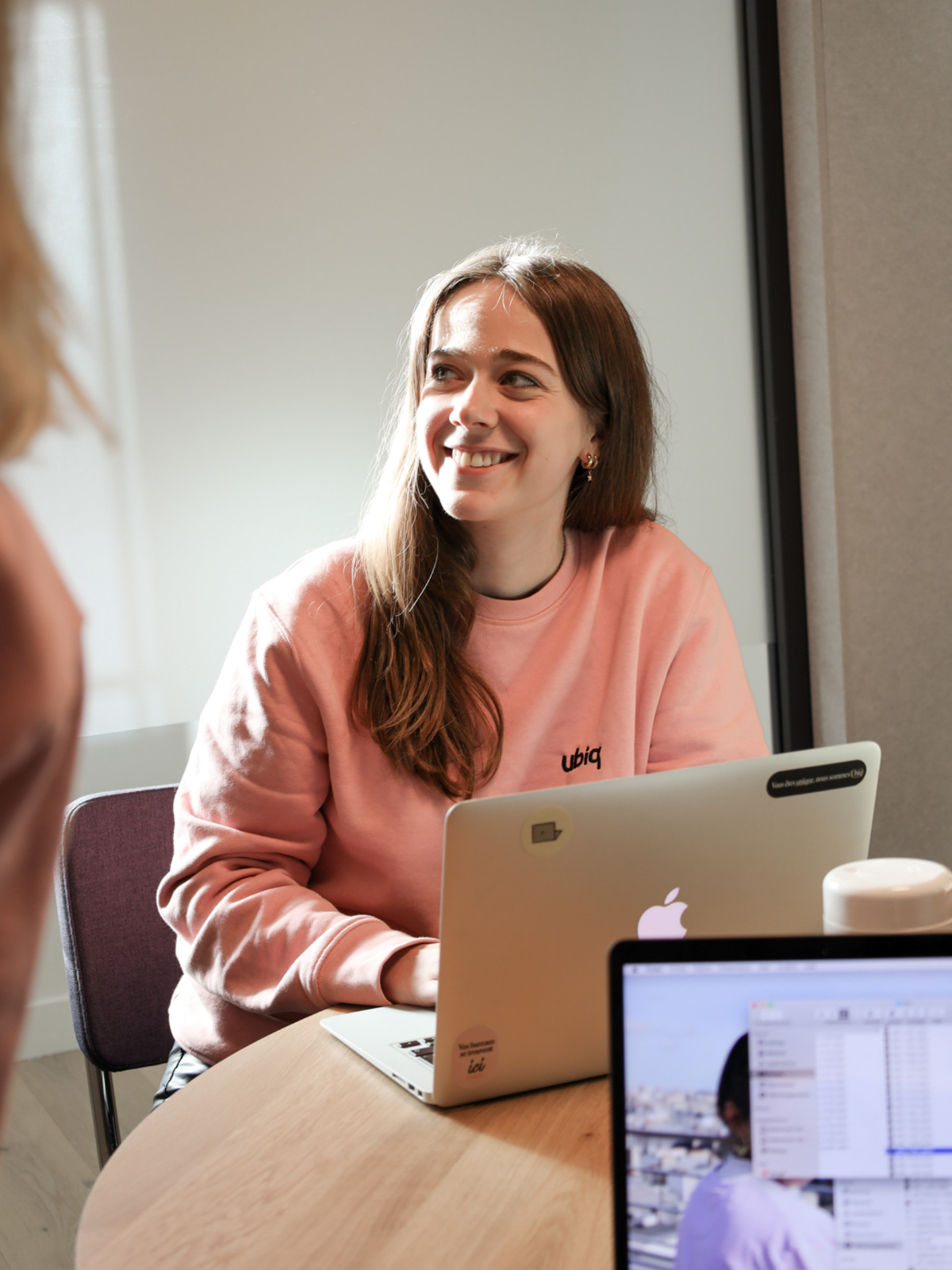 Woman smiling on computer