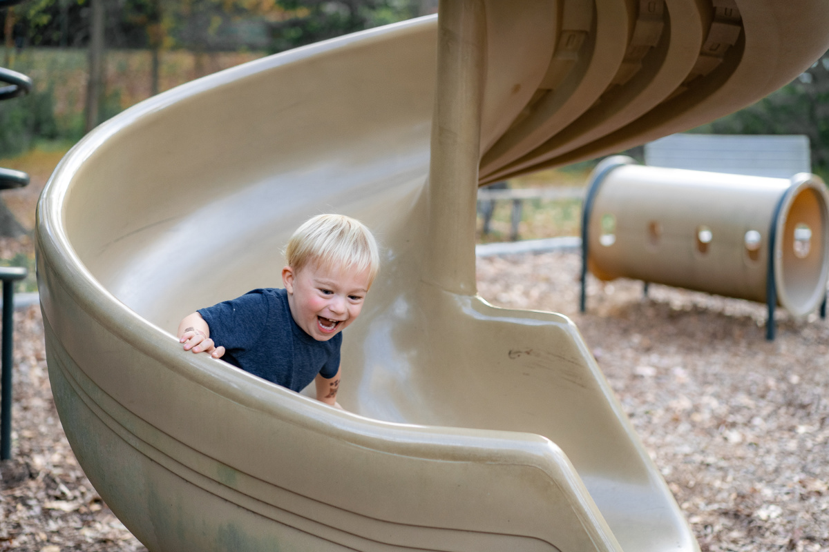 Kid going down slide